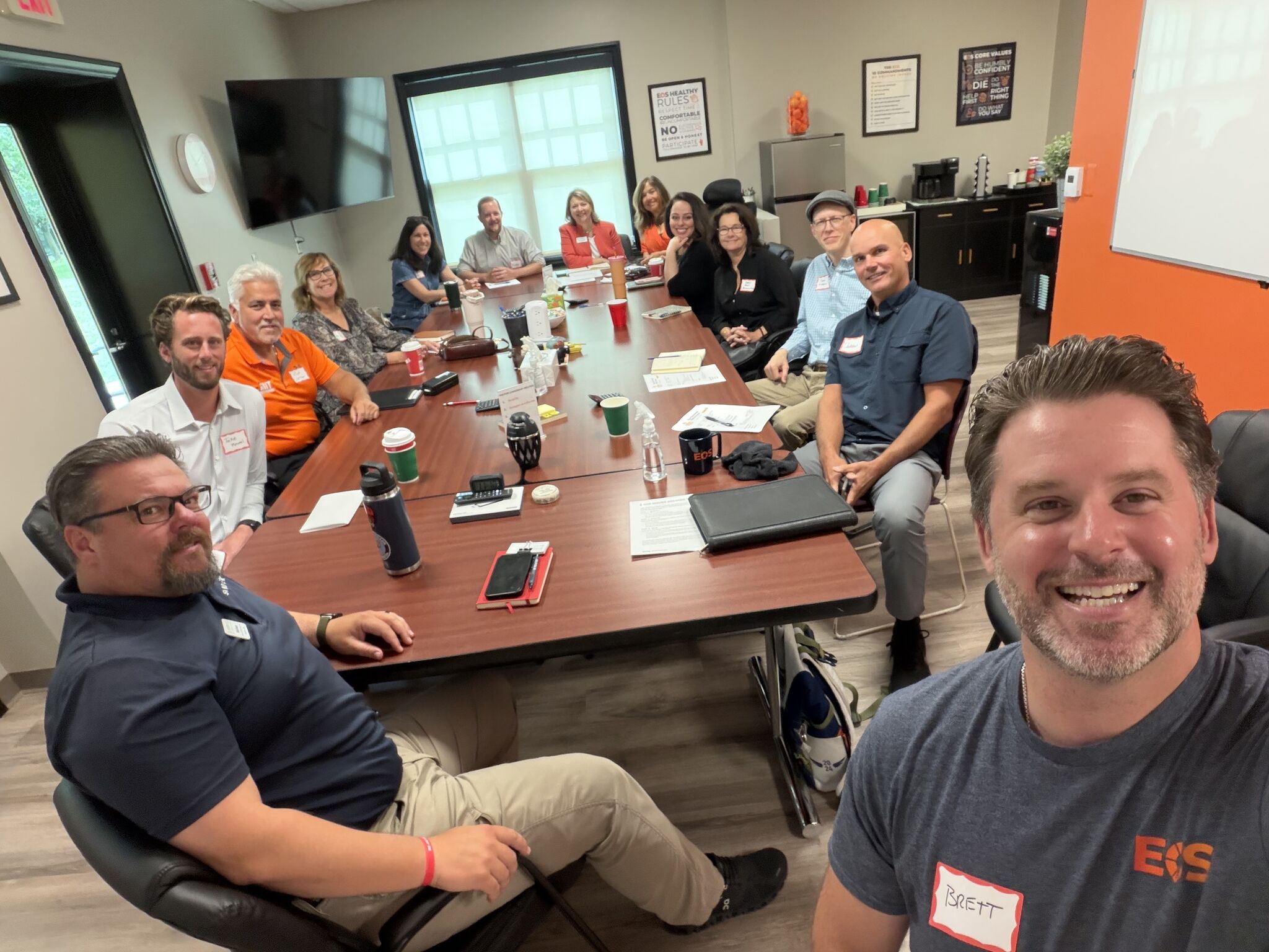A group of business owners sitting around a table at the ENRG East Detroit chapter meeting in August 2026