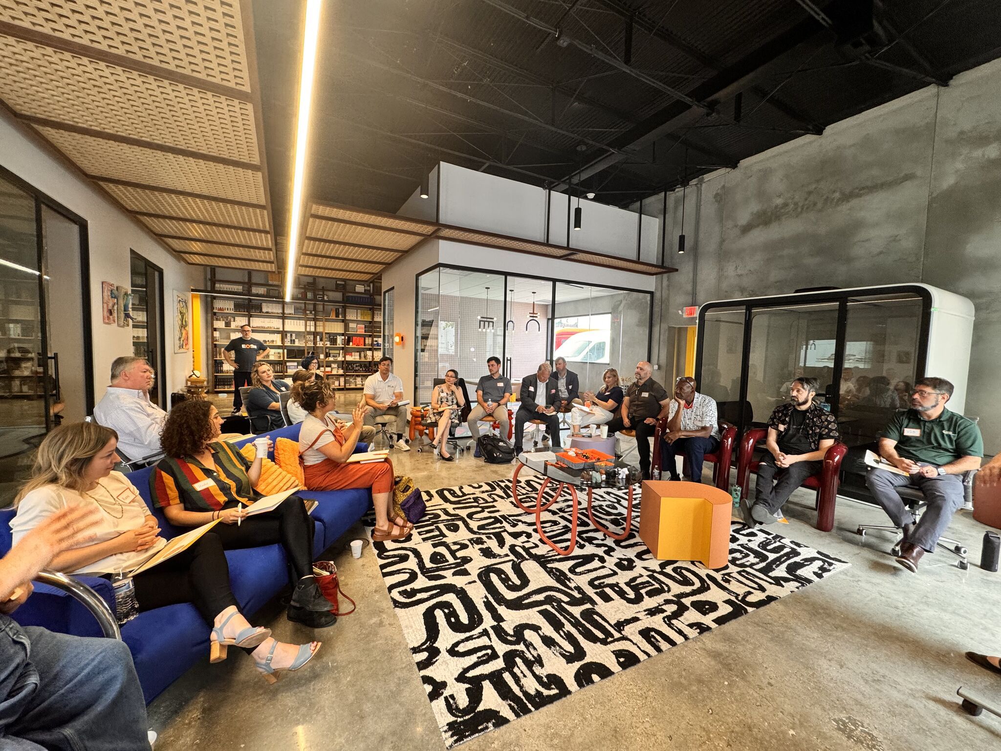 A group of business owners sitting around a large meeting room at the ENRG New Orleans chapter meeting